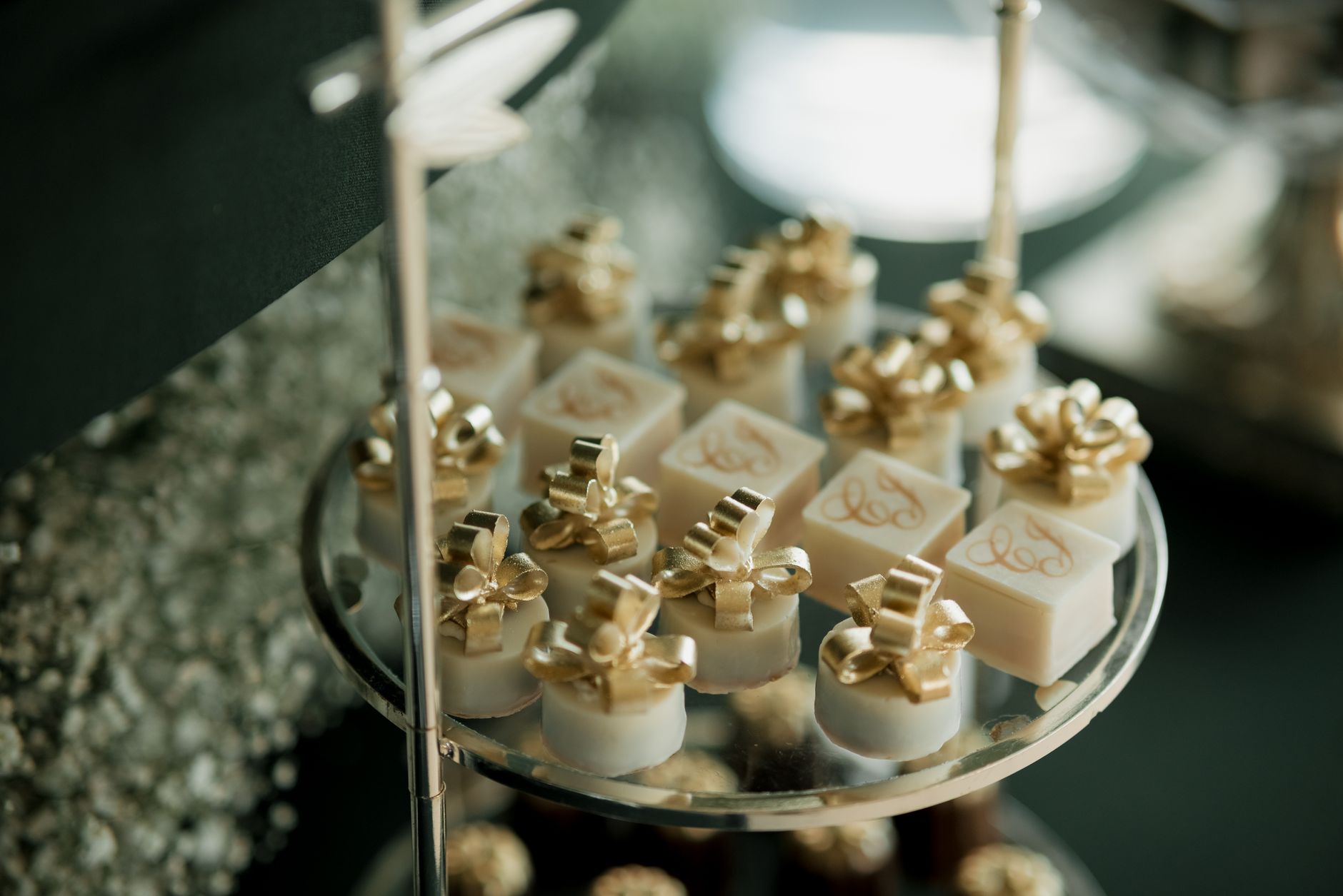 Elegant confections with gold toppings beautifully arranged for a sophisticated event.